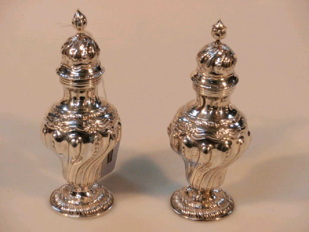 Appraisal: A pair of late Victorian silver pepperettes by Thomas Walter