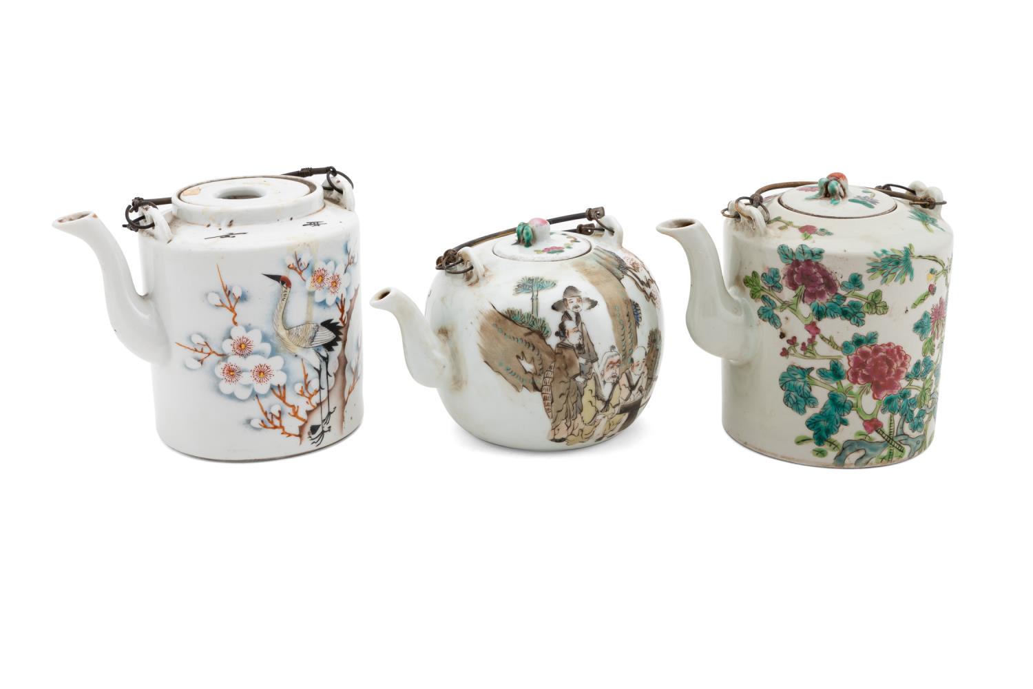 Appraisal: THREE CHINESE PORCELAIN LIDDED TEAPOTS Three Chinese porcelain teapots comprising