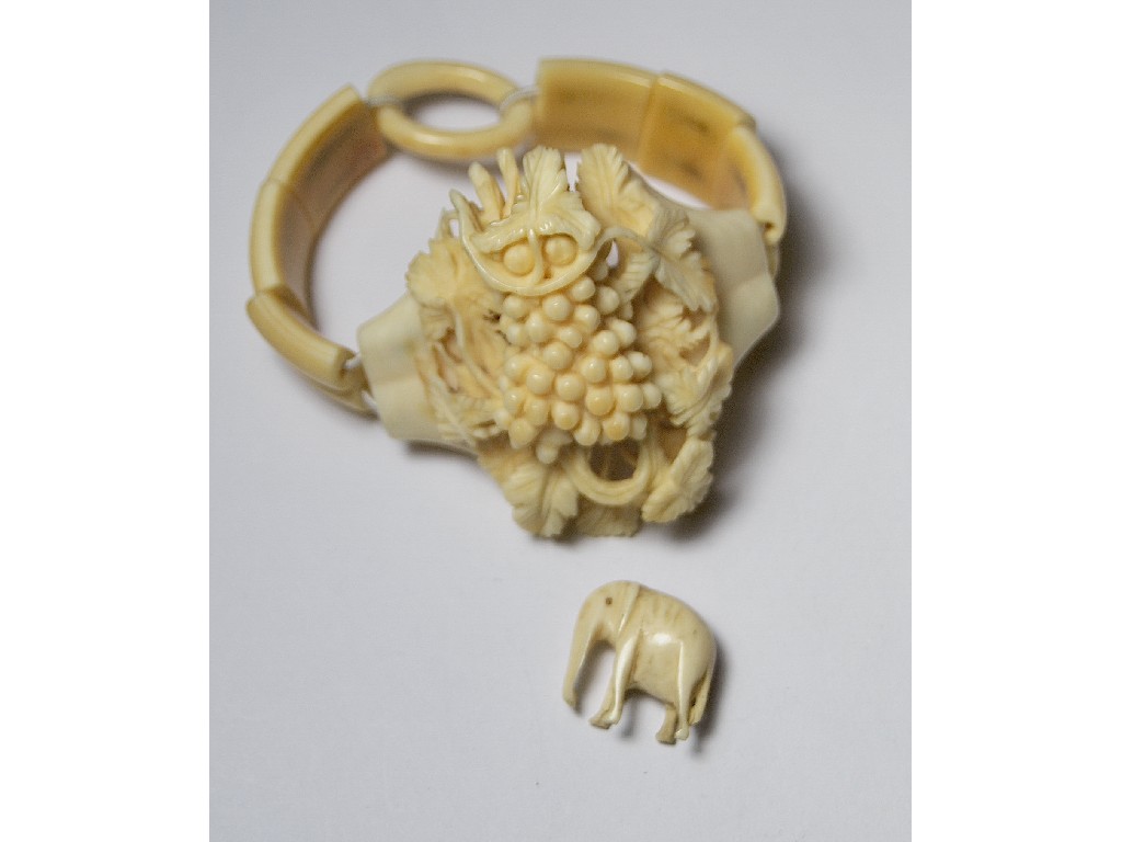 Appraisal: Victorian carved ivory bracelet of grape and vine motif to