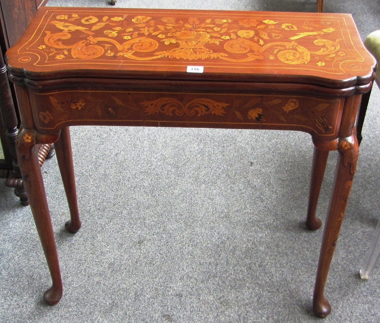 Appraisal: An th century Dutch walnut marquetry inlaid card table the