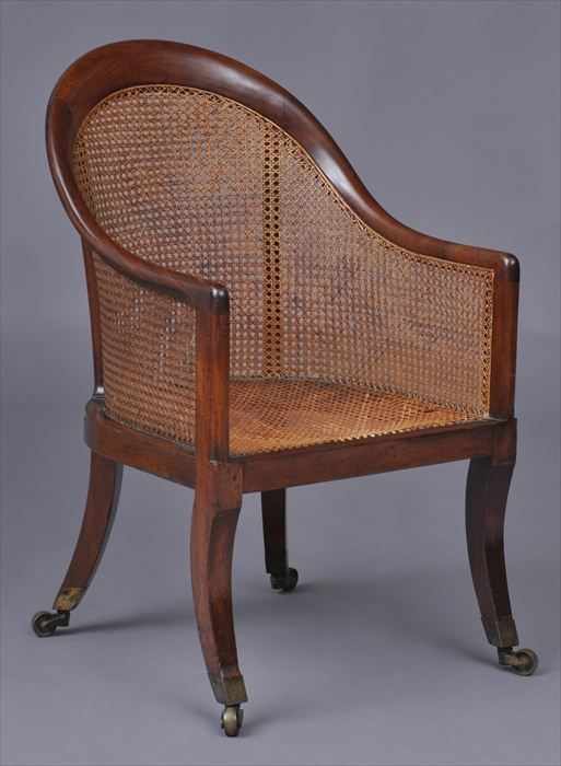 Appraisal: REGENCY MAHOGANY TUB-BACK ARMCHAIR With cane back arm panels and