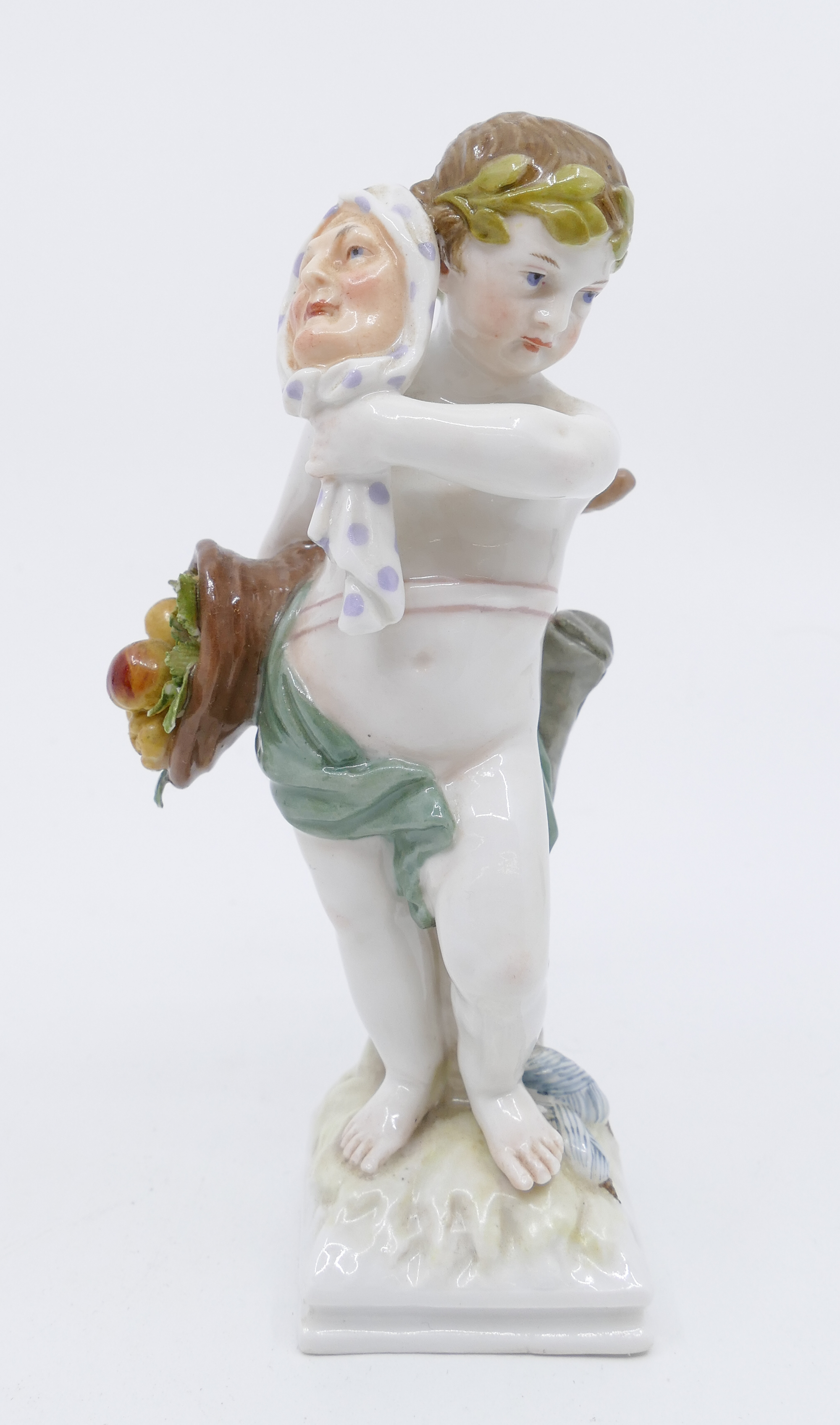 Appraisal: KPM Child with Cornucopia and Mask Porcelain Figurine some small