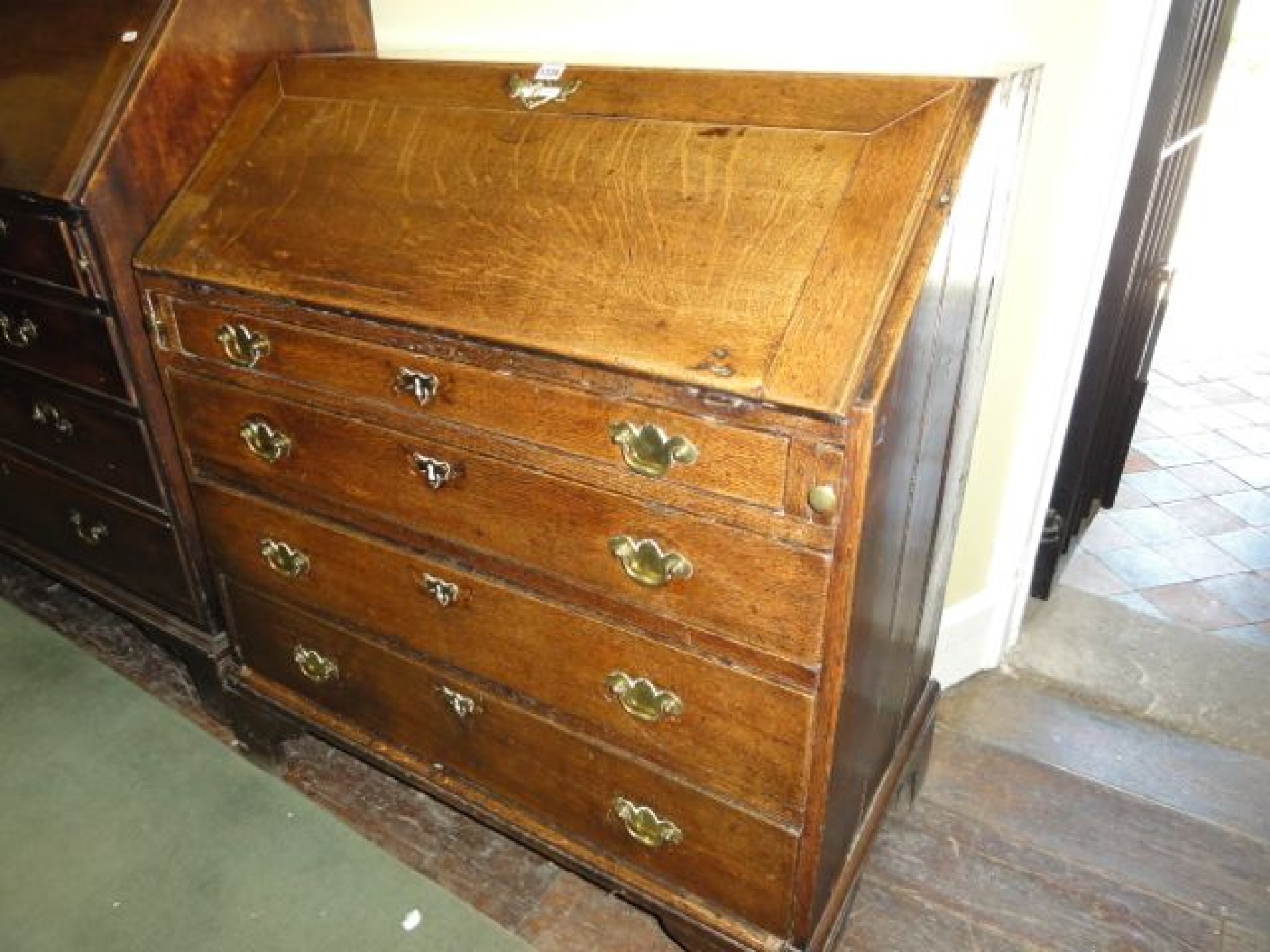 Appraisal: A Georgian country made oak bureau of four long graduated