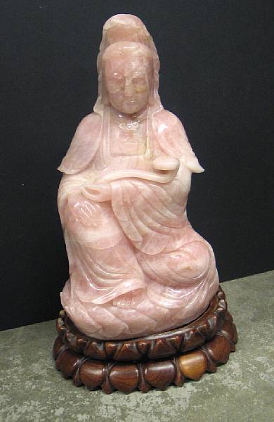 Appraisal: A large carved rose quartz figure of Guanyin The white-robed