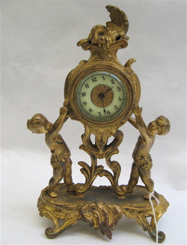 Appraisal: AN AMERICAN GILT METAL FIGURAL SHELF MANTEL CLOCK Twin figures