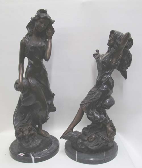 Appraisal: TWO FIGURAL BRONZE SCULPTURES depicting standing women with flowing gowns