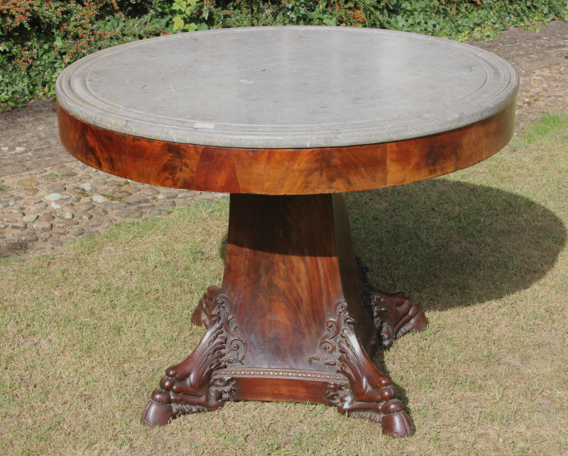 Appraisal: An early thC French flamed mahogany centre table with carved