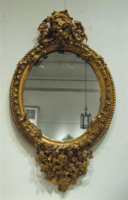 Appraisal: Victorian gilt-gesso mirror th century The oval mirror plate surrounded