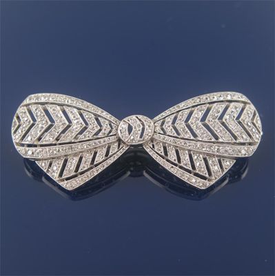 Appraisal: A early th century diamond set bow brooch by Boucheron