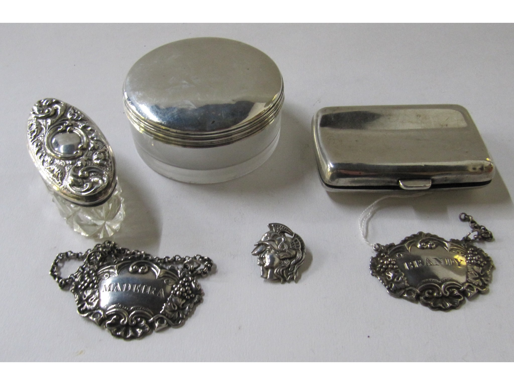 Appraisal: A lot comprising two Victorian silver decanter labels a silver