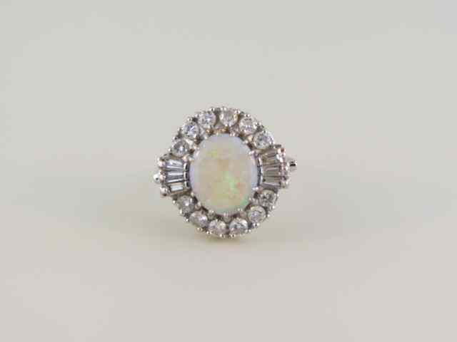 Appraisal: Opal Diamond Ring fiery blue-green carat oval gem surrounded by