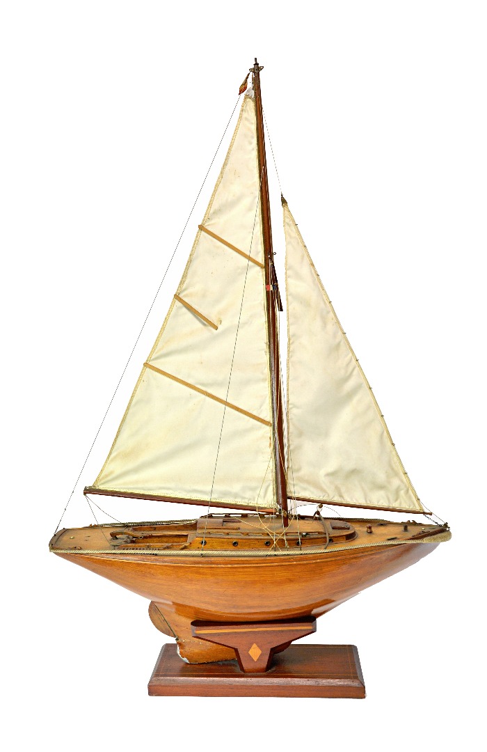 Appraisal: A wooden model sailing boat naturalistically painted and with a