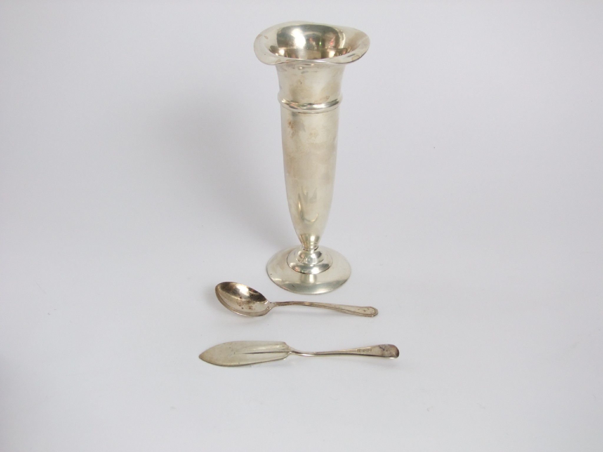 Appraisal: A silver trumpet shaped flower vase on turned base weighted