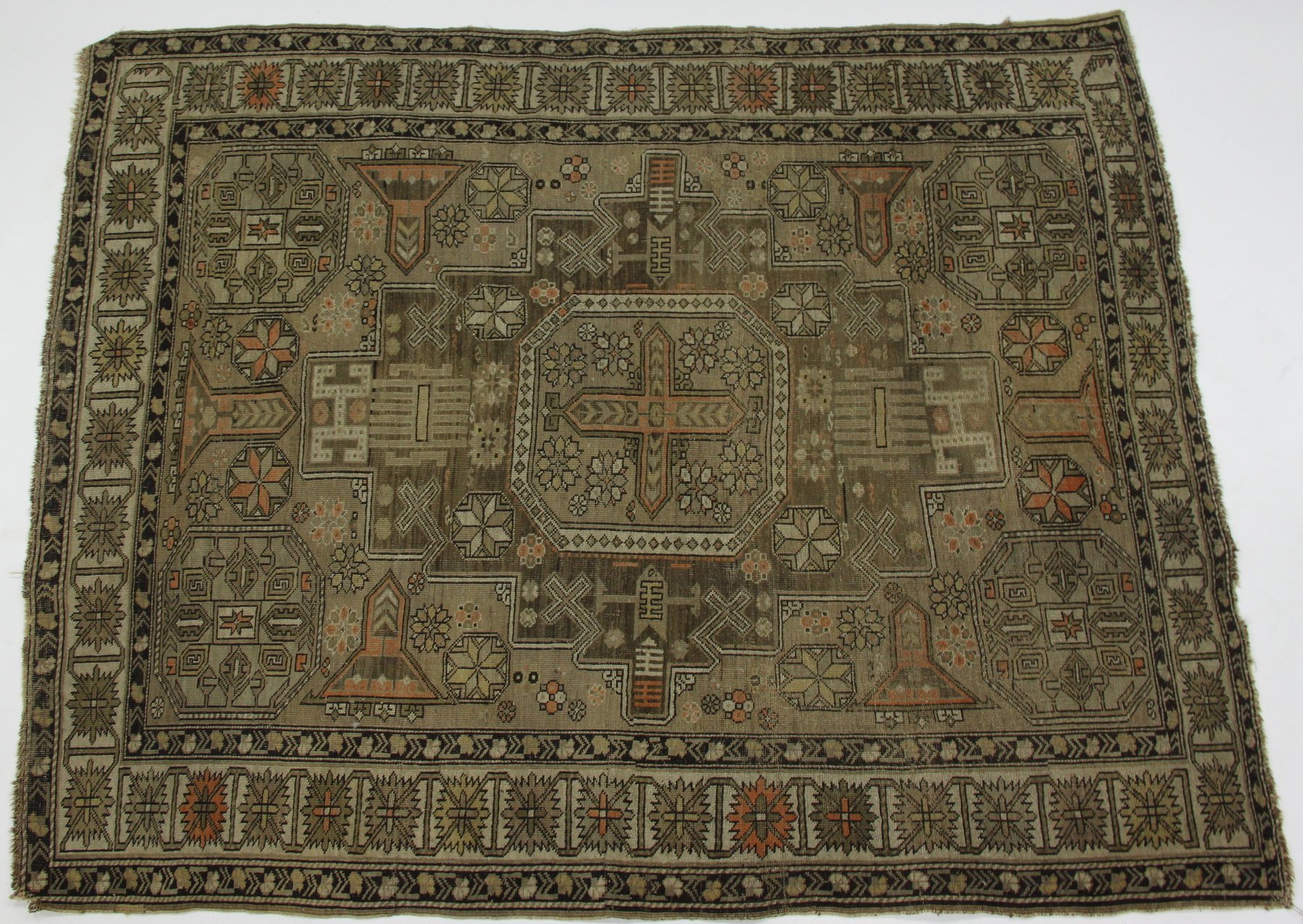 Appraisal: A Karachor Kazak rug the madder field decorated with central