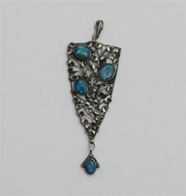 Appraisal: An Arts and Crafts white metal and composite opal pendant