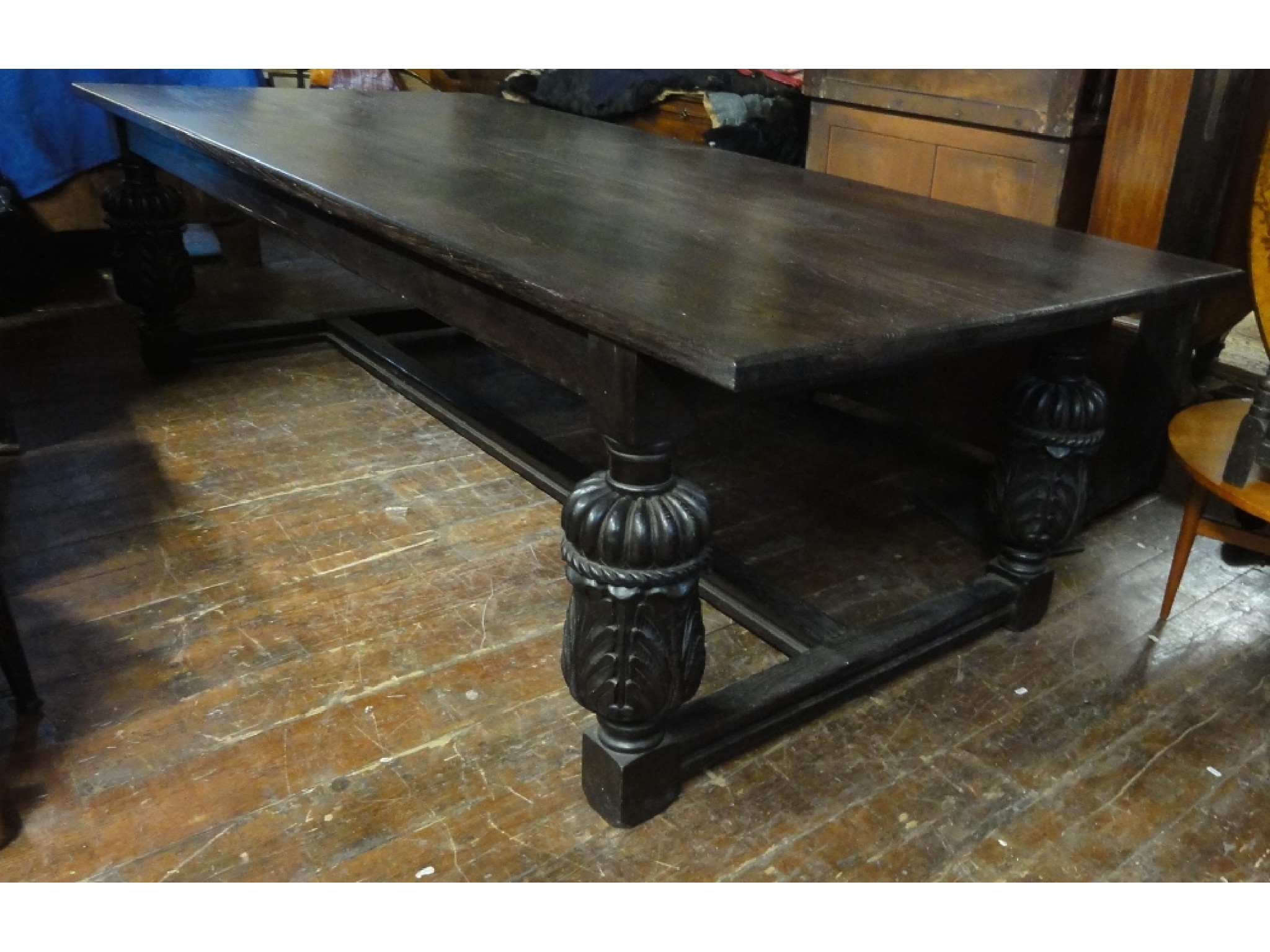 Appraisal: A substantial Elizabethan style oak refectory table raised on four