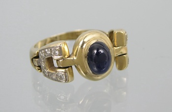 Appraisal: A Flexible Gold Ring with Sapphire and Diamonds k yellow