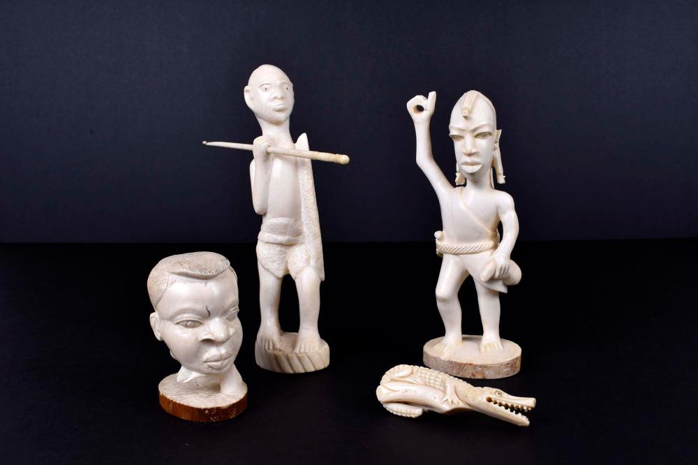 Appraisal: THREE AFRICAN CARVED FIGURES AND A CROCODILEThe first and second