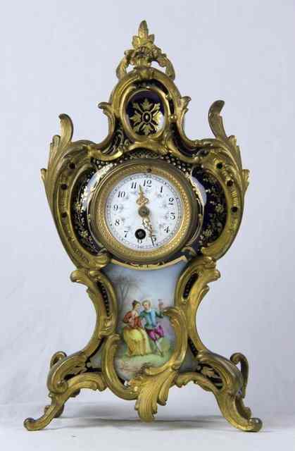 Appraisal: A Louis XV style Paris porcelain mantel timepiece with decorated