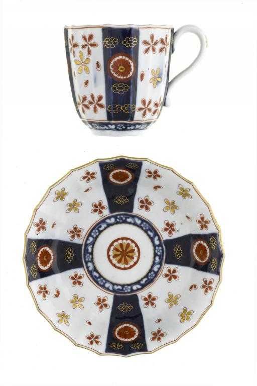 Appraisal: A WORCESTER IMARI FLUTED COFFEE CUP AND SAUCER decorated with