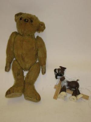 Appraisal: An early th century teddy bear straw filled covered in