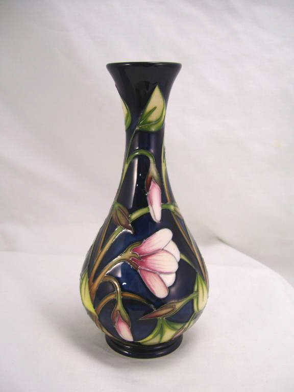 Appraisal: Moorcroft Pottery Vase Bottle neck vase with cobalt and cyclamen