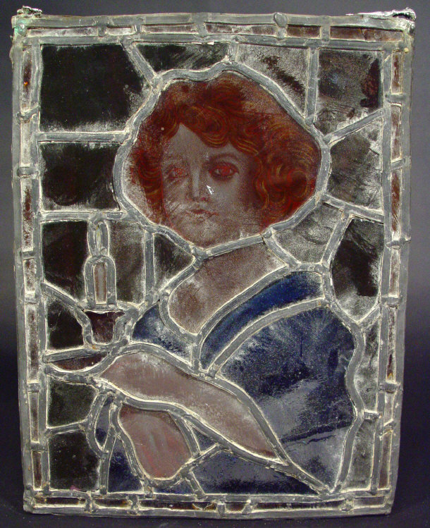 Appraisal: Leaded stained glass panel depicting a young woman clutching a