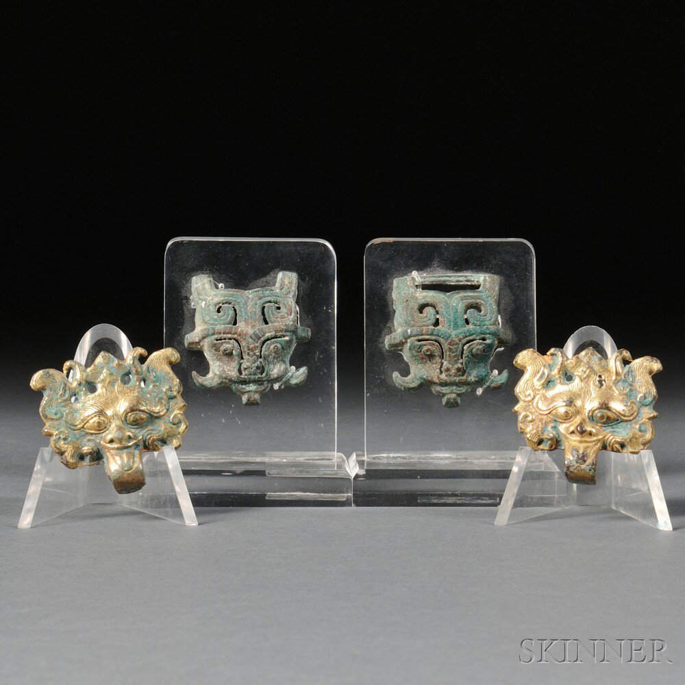 Appraisal: Four Bronze Fittings China Tang Dynasty style two gilt-bronze lion-head-shaped