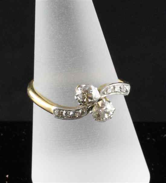 Appraisal: An ct gold two stone diamond cross-over ring with brilliant