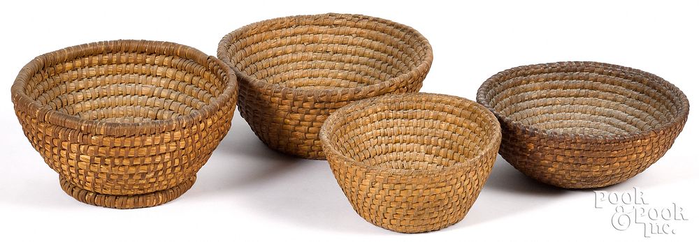 Appraisal: Four Pennsylvania rye straw baskets th c Four Pennsylvania rye