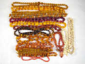 Appraisal: A mixed lot comprising eighteen necklaces including amber and hardstone