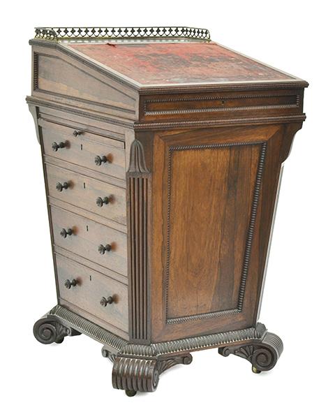 Appraisal: A REGENCY ROSEWOOD DAVENPORT the tapered body with four drawers