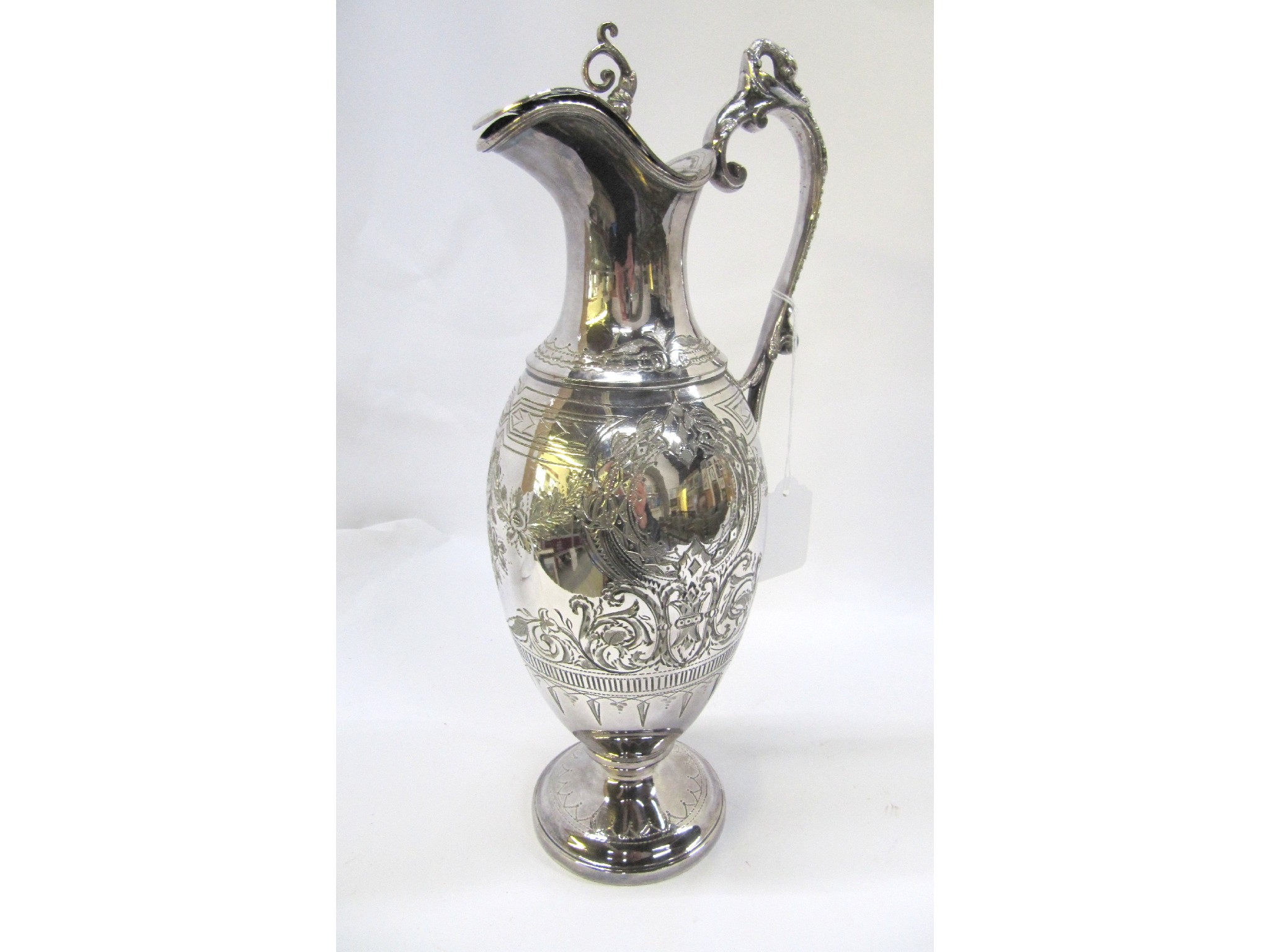 Appraisal: A silver plated claret jug