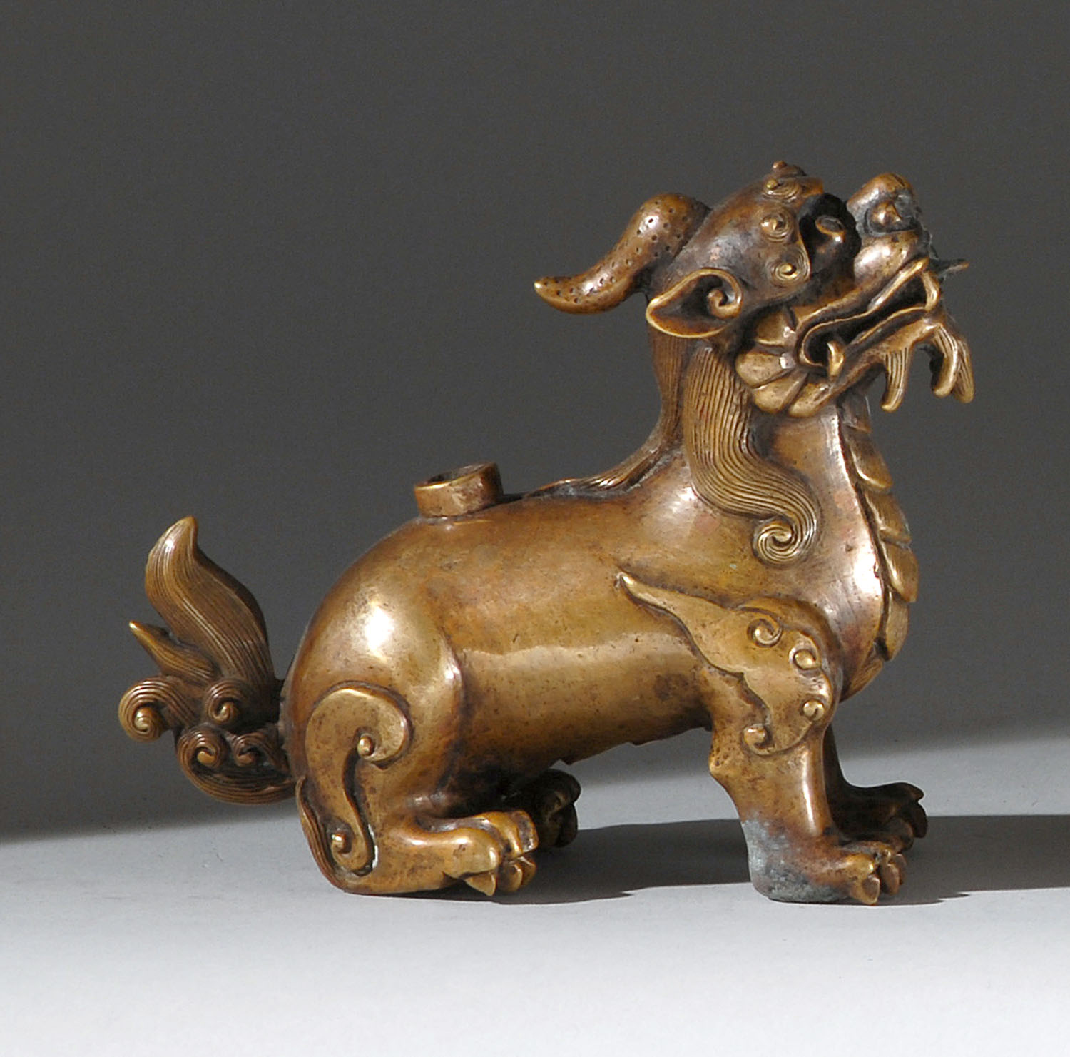 Appraisal: BRONZE WATER DROPPER Circa In qilin form with detailed mane