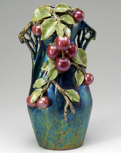 Appraisal: STYLE OF TEPLITZ Iridescent vase with applied cherry leaf and