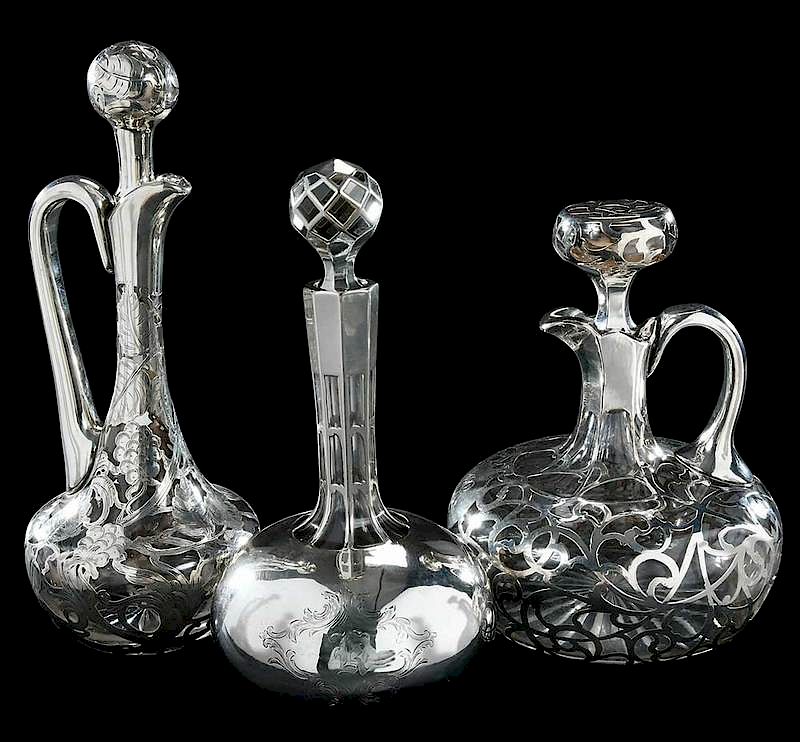 Appraisal: Three Silver Overlay Decanters one Alvin handled with monogram -