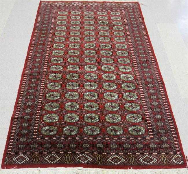 Appraisal: HAND KNOTTED BOKHARA AREA RUG Indo-Bokhara repeating columns of Turkoman