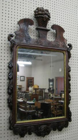 Appraisal: Antique carved wall mirror with basket of fruit finial tall