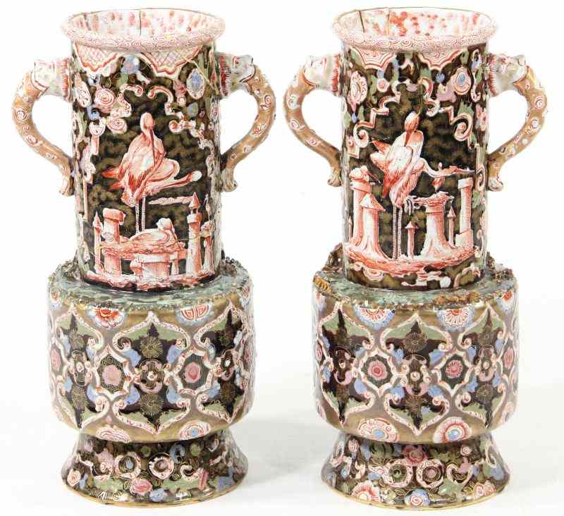 Appraisal: Pair of French Faience Vasescirca each double handled with mask