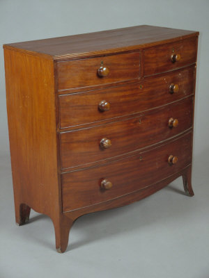 Appraisal: A George IV mahogany bowfront chest of two short and