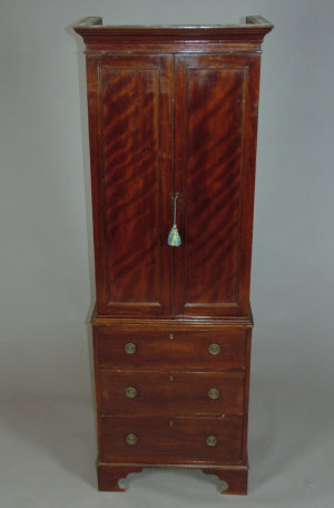 Appraisal: A mahogany press cupboard mid th century of narrow proportions