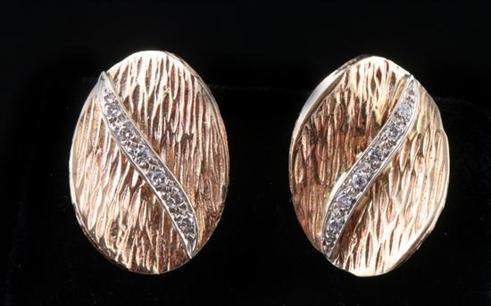 Appraisal: PAIR K YELLOW GOLD AND DIAMOND OVAL EARRINGS Each textured