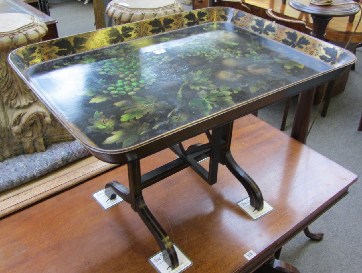 Appraisal: A late Victorian papier mache tray on stand painted with