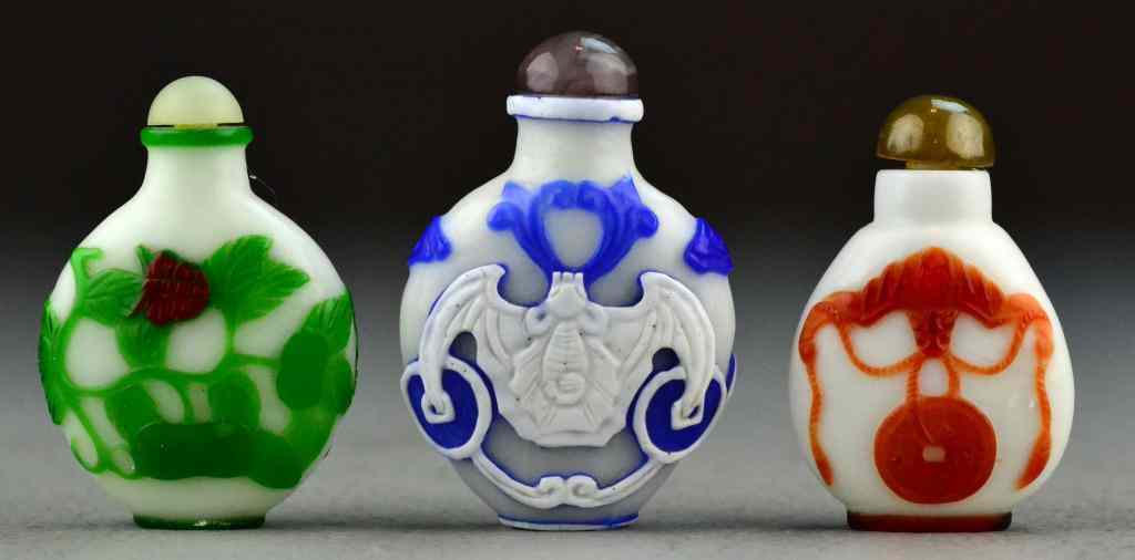 Appraisal: Chinese Peking Glass Snuff BottlesTo include three snuff bottles two