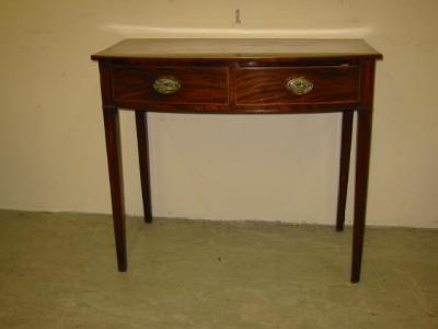 Appraisal: A MAHOGANY SIDE TABLE of bowed form with string inlaid