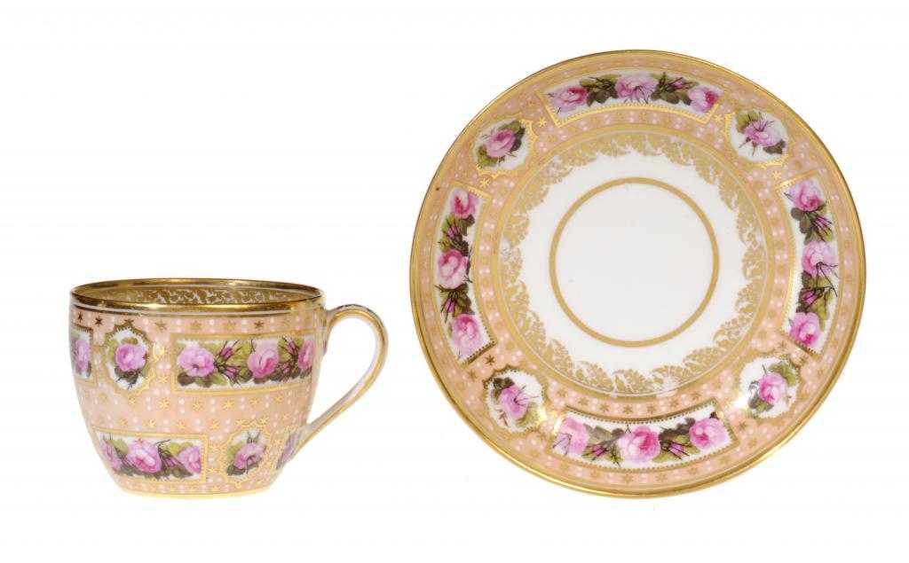 Appraisal: A DERBY BLOOM GROUND TEACUP AND SAUCER of bute shape