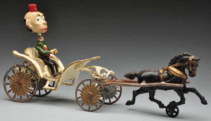 Appraisal: Cast Iron Hubley Phaeton Horse-Drawn Toy Description American With Happy