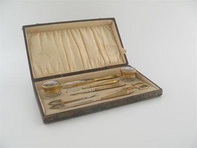 Appraisal: A cased gilt metal mounted steel manicure set some pieces