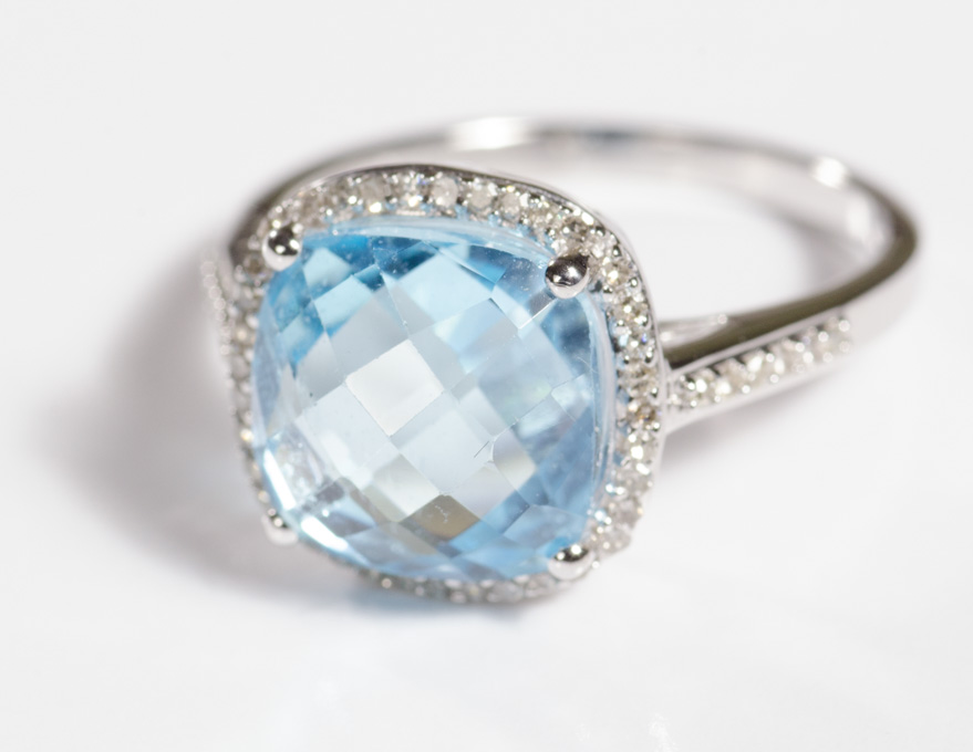 Appraisal: BLUE TOPAZ AND DIAMOND RING k white gold with round-cut