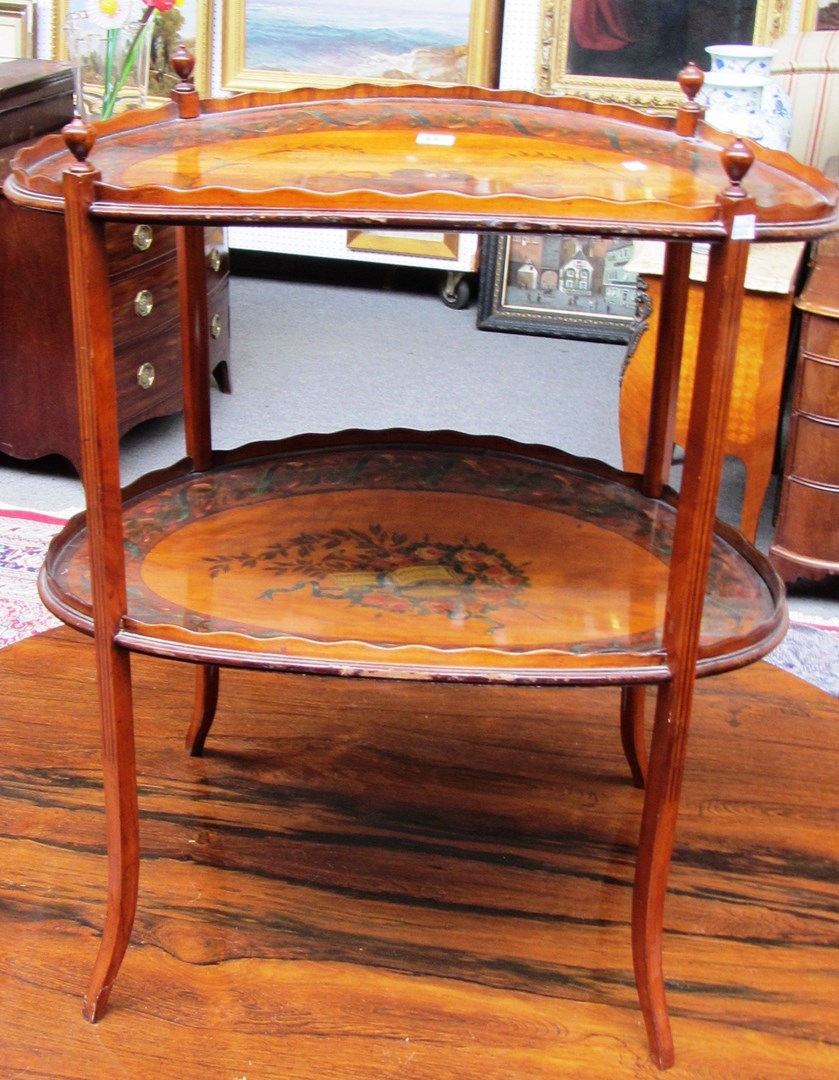 Appraisal: A th century painted satinwood two tier etagere on splayed